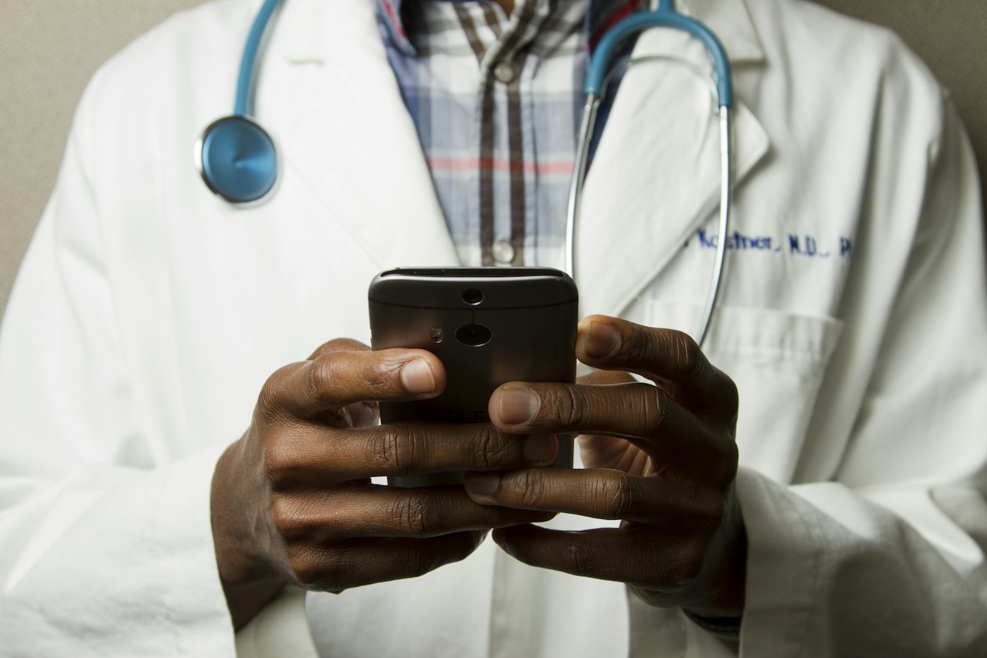 Doctor speaking with a patient using a tablet