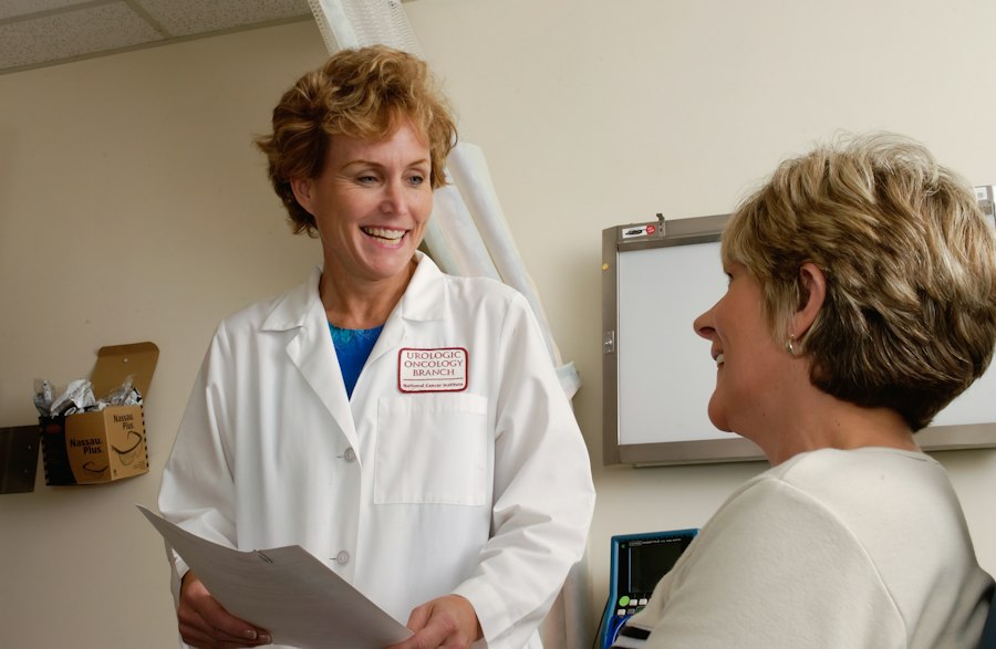 Doctor speaking warmly with a patient in a clinic